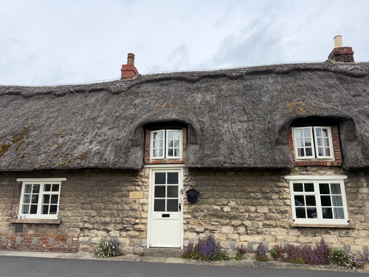 Eyebrow dormers within Grade II listed thatched cottage