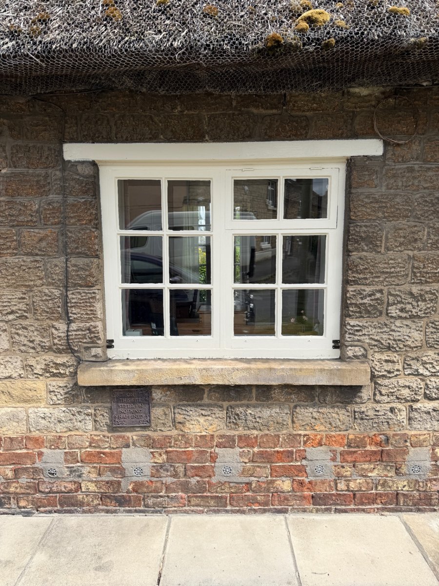 Traditional timber casement window to Grade II listed cottage