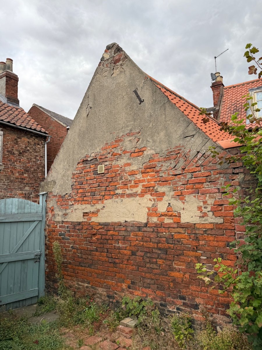 Distorted historic rear gable wall