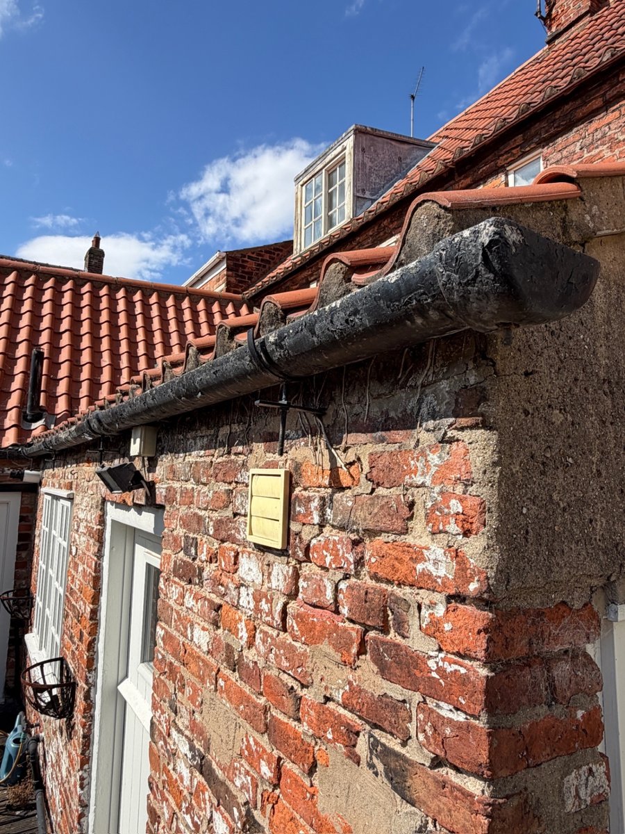 Weathered historic brickwork and mortar pointing