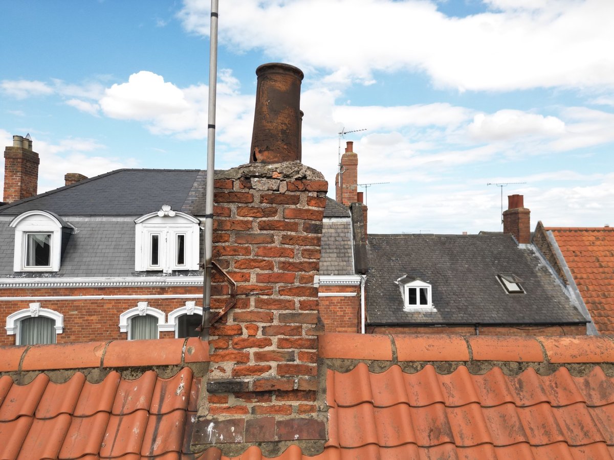 Historic chimney pots and upper masonry
